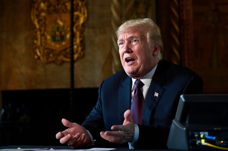 FILE - In this Thursday, Nov. 22, 2018 file photo, President Donald Trump speaks to reporters following his teleconference with troops from his Mar-a-Lago estate in Palm Beach, Fla. President Donald Trump says he will be making Palm Beach, Florida, his permanent residence after he leaves the White House, rather than returning to Trump Tower in New York. Trump tweeted late Thursday, Oct. 31, 2019 that he cherished New York. But he added that "despite the fact that I pay millions of dollars in city, state and local taxes each year, I have been treated very badly by the political leaders of both the city and state." (AP Photo/Susan Walsh, File)