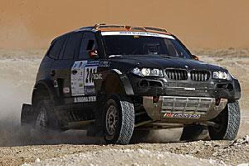 Nasser Al Attiyah and Tina Thorner reach a checkpoint in the Empty Quarter during the UAE Desert Challenge last year.