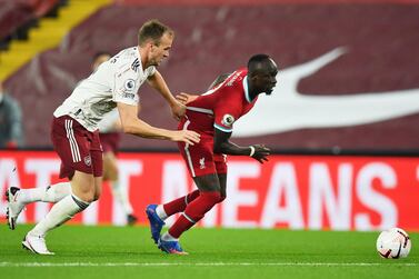 Sadio Mane (R) of Liverpool in action against Rob Holding of Arsenal during the English Premier League match between Liverpool and Arsenal London in Liverpool, Britain, September 28, 2020. EPA