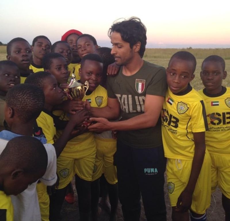 Salem Alkarbi hosts events for disadvantaged children worldwide through his football charity "Beyond the Boundaries of Football". Here he is in Zimbabwe. Courtesy Salem Alkarbi