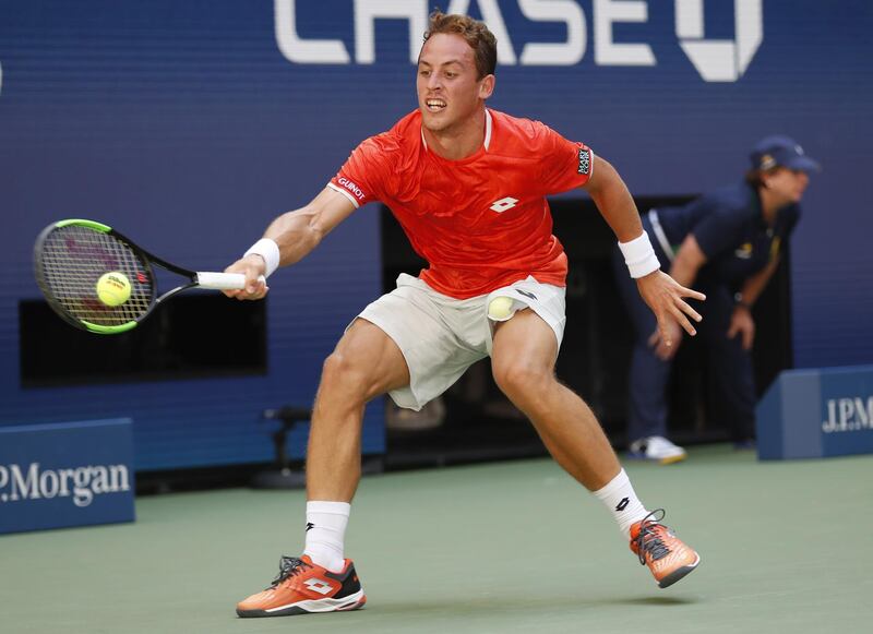 Roberto Carballes Baena of Spain hits a return to Novak Djokovic. EPA