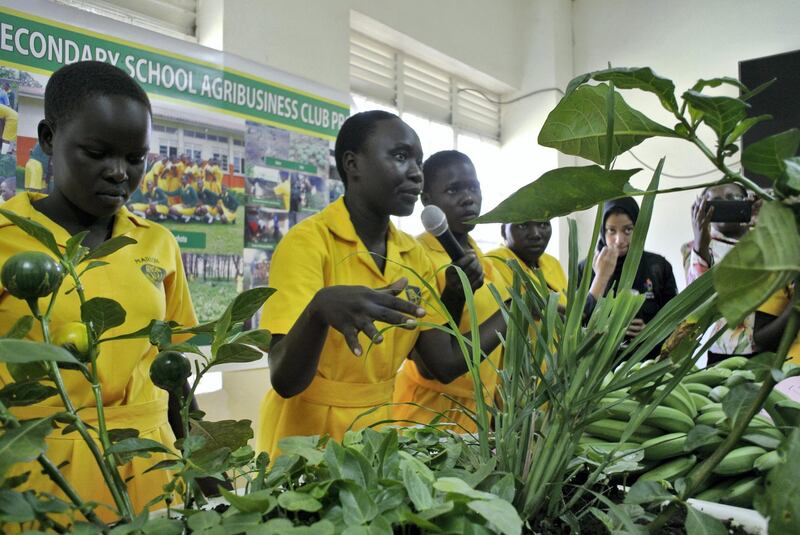 LIRA, UGANDA, Thursday, November, 23, 2017 // Dolly Akello, second from left, president of the agriculture club at St Katherine Secondary School, talks to officials from Dubai Cares about the fruits and vegetables the pupils grow on campus Thursday, November 23, 2017. St. Katherine Secondary School is one of 40 schools in 39 districts across Uganda to share in a US$1,188,280 donation from Dubai Cares aimed at promoting girls’ participation in stem subjects. In all, about 6,000 pupils, 500 science teachers and 40 head teachers will directly benefit from the funding, which is being managed and distributed by the Forum for African Women Educationalists – Uganda Chapter through 2019. (Roberta Pennington/The National)  