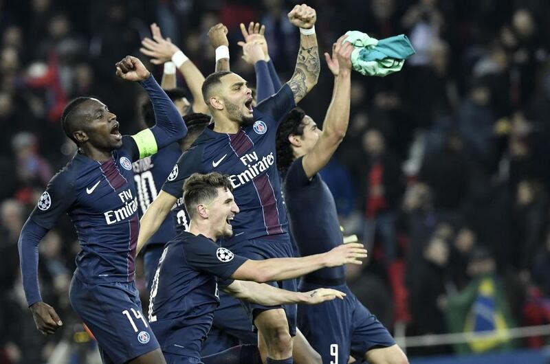 Paris Saint-Germain celebrate their victory over Barcelona in the Uefa Champions League last 16. Philippe Lopez / AFP