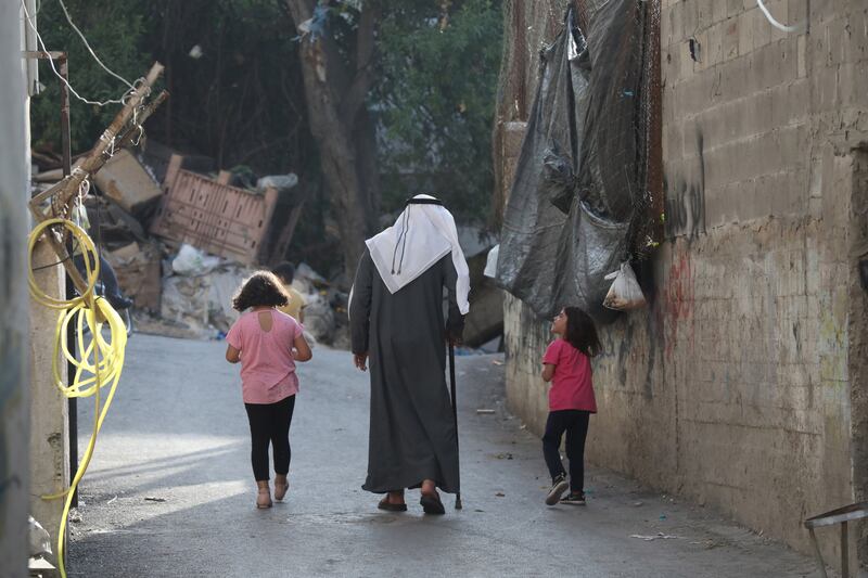 For Mr Awad, pictured with his grandchildren, the keepsakes serve as a reminder of the past before Nakba