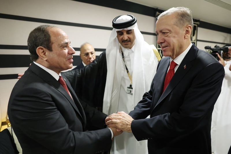 Turkish President Recep Tayyip Erdogan shakes hands with Egyptian President Abdel Fattah El Sisi as they are welcomed by Emir Sheikh Tamim. AFP