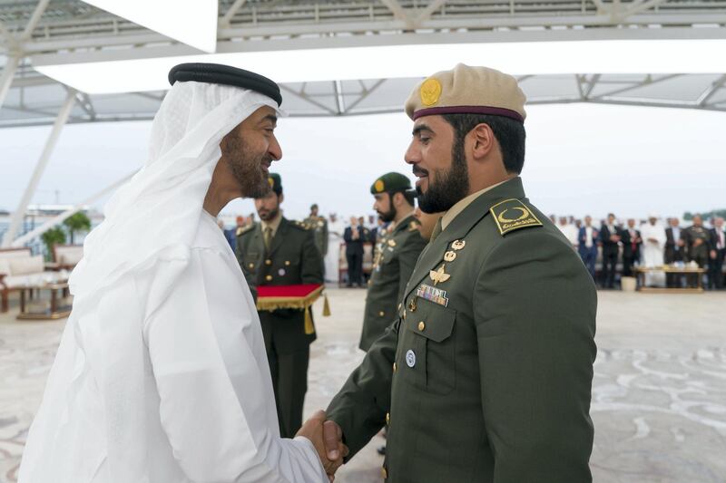ABU DHABI, UNITED ARAB EMIRATES - November 12, 2018: HH Sheikh Mohamed bin Zayed Al Nahyan Crown Prince of Abu Dhabi Deputy Supreme Commander of the UAE Armed Forces (L), awards a members of the UAE Armed Forces with Medals of Bravery and Medals of Glory, during a Sea Palace barza.

( Rashed Al Mansoori / Ministry of Presidential Affairs )
---