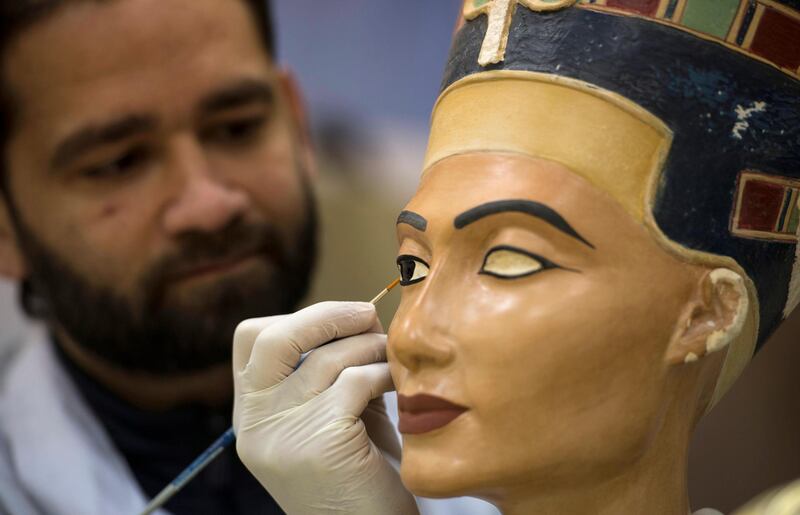 An artist gives final touch to a statue of queen Nefertiti at Replica Production Unit located at Salah Al Din Citadel in Cairo, Egypt. EPA