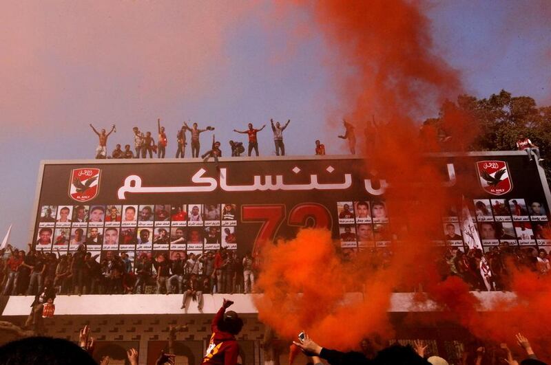 Al Ahly supporters celebrate on March 9, 2013 the conviction and death sentence of 21 people for their role in the Port Said disaster. Amr Nabil / AP