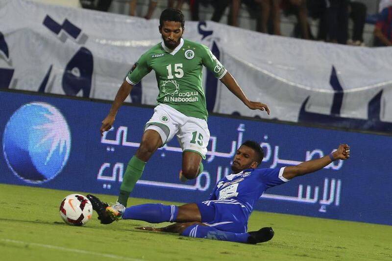 Dawood Ali, No 15, and Al Shabab, pictured during an Arabian Gulf League match in Dubai on April 11, 2014, have a three-point advantage on their rivals for second place and an automatic Asian Champions League berth. Al Ittihad