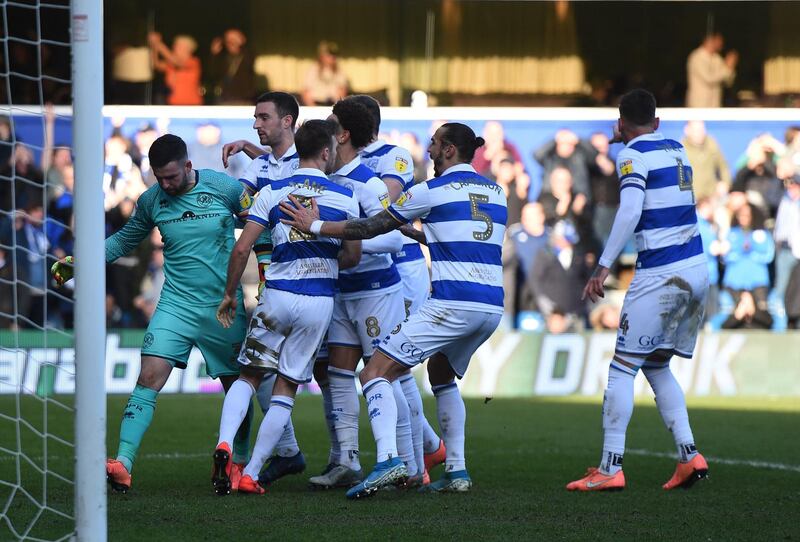 Queens Park Rangers goalkeeper Liam Kelly is mobbed by teammates after saving a Patrick Bamford penalty. QPR won 1-0 on January 18. PA