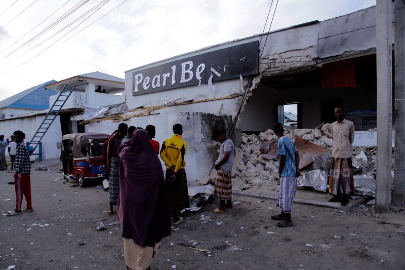 The heavily damaged Pearl Beach Hotel in Mogadishu on Saturday after security forces and Al Shabab extremists fought. AP Photo 