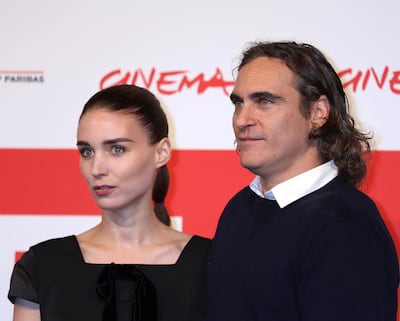 W044B8 Joaquin Phoenix (R) and Rooney Mara arrive at a photo call for the film "Her" during the 8th annual Rome International Film Festival in Rome on November 10, 2013.   UPI/David Silpa