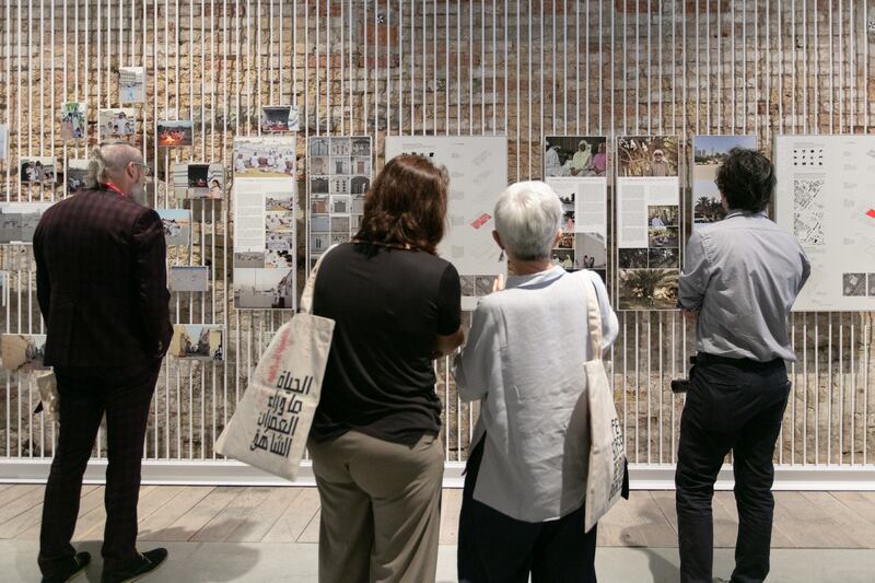 Visitors to the Venice Biennale examining Lifescapes Beyond Bigness, the UAE’s National Pavilion exhibition in 2018