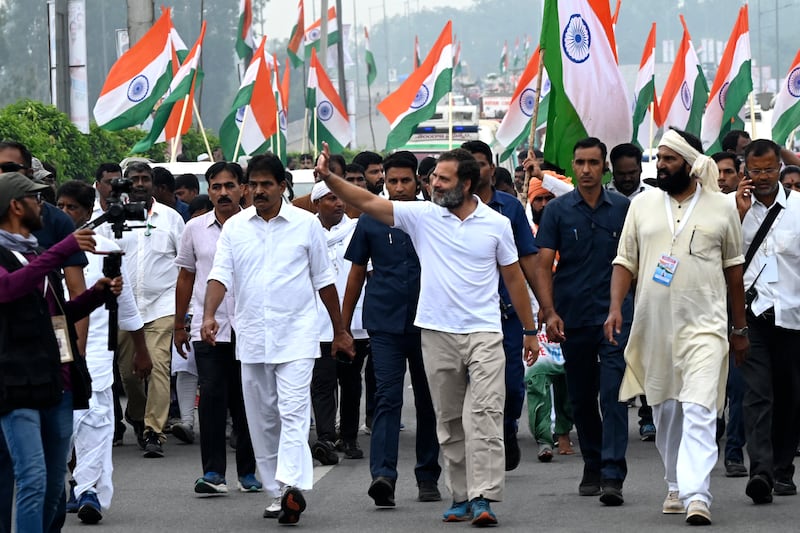Rahul Gandhi, centre, a leader in India's Congress party, takes part in the Bharat Jodo Yatra, or Unite India March, on the outskirts of Hyderabad on November 1 last year. The march is a five-month, 3,570km trek through 12 states. AFP