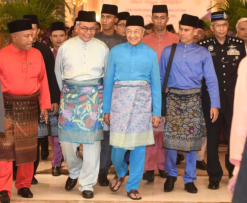 Prime Minister Mahathir Mohamad arrives for Eid al-Fitr open house in Putrajaya, Malaysia. AP