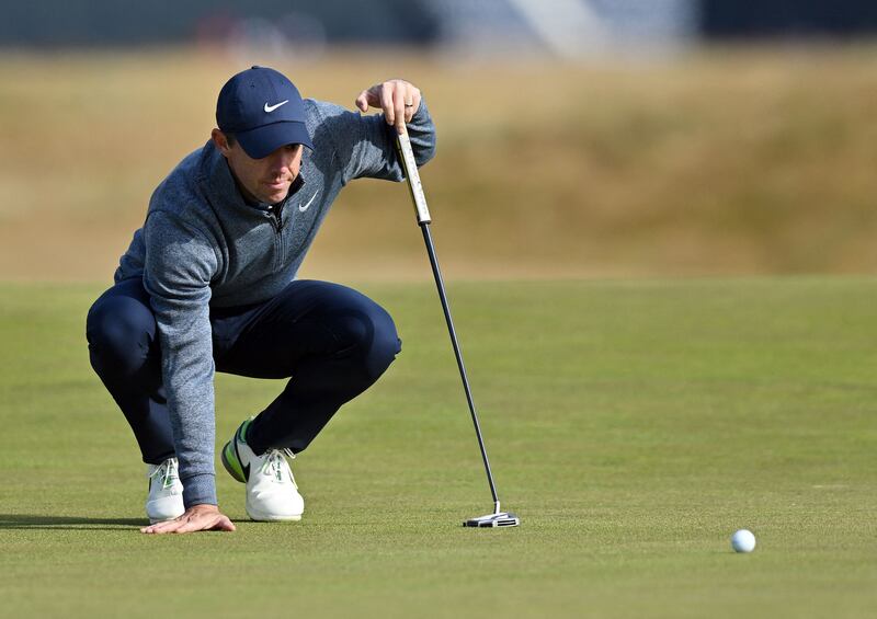 Rory McIlroy lines up a putt on the 17th green during a practice round for The Open at St Andrews in Scotland on Wednesday, July 13, 2022. AFP