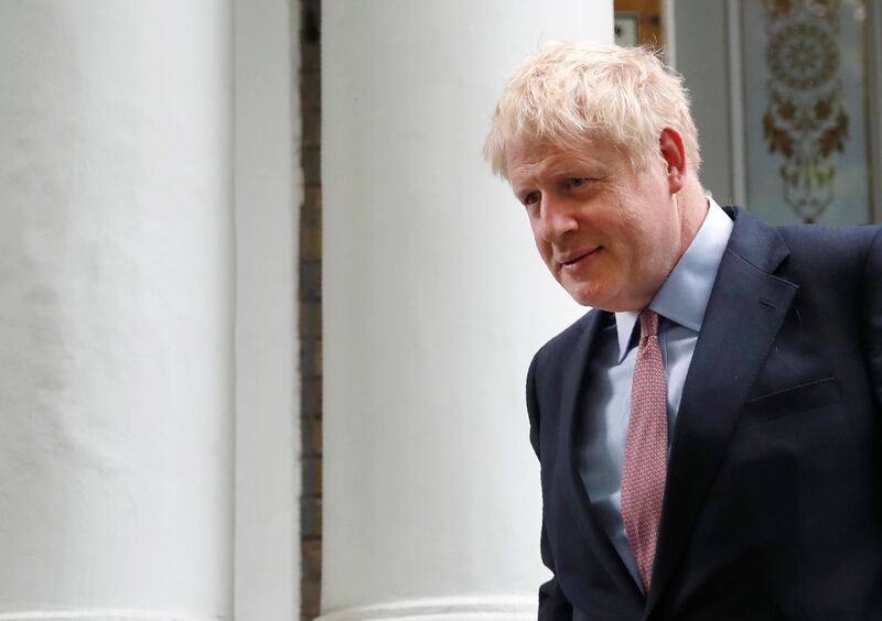 British Conservative party lawmaker Boris Johnson leaves home in south London, Friday, June 14, 2019.  Johnson is a leading candidate in the Conservative Party leadership campaign to be the next British Prime Minister. (AP Photo/Alastair Grant)