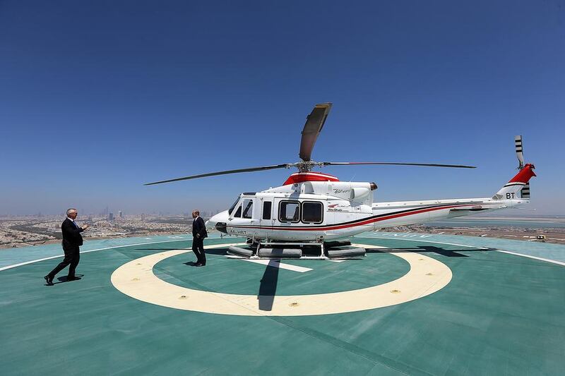 <a href="http://www.thenational.ae/business/aviation/abu-dhabi-aviation-diversifying-business">Abu Dhabi Aviation </a>is the biggest commercial helicopter operator in the Middle East. Above, one of the company’s Bell helicopters. Satish Kumar / The National