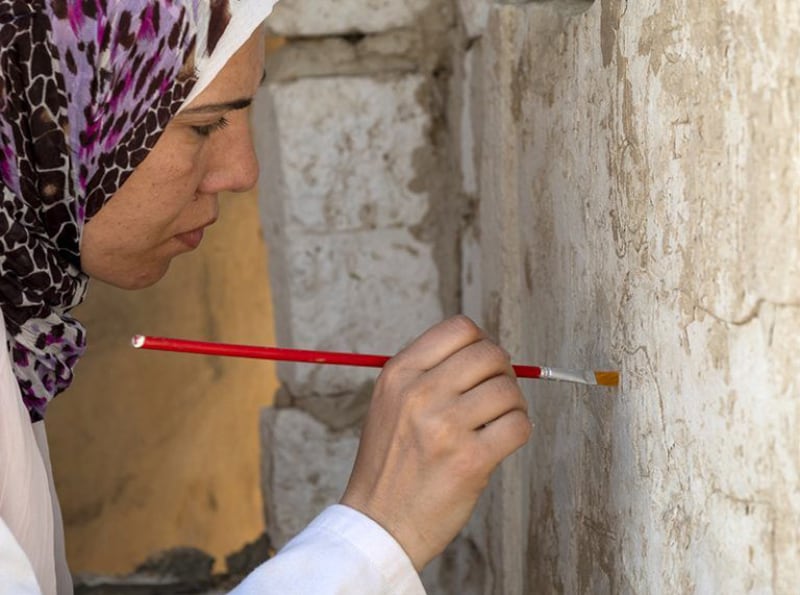 Egyptian restorer Basma Zaghloul at work on the stela of Panehsy. Photo: The National Museum of Antiquities in Leiden