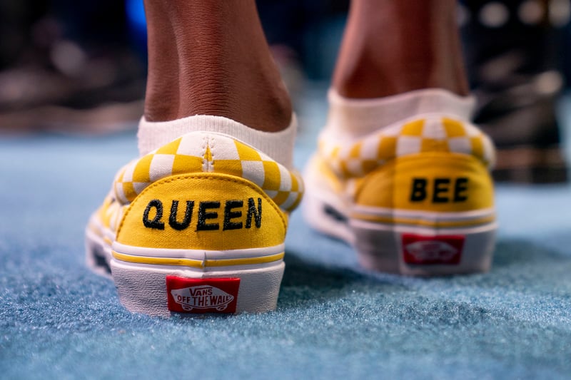 Vivinsha Veduru from Keller, Texas, wears shoes that read 'Queen Bee' as she competes. AP