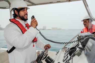 Capt Saleh ba Abbad, head of the oil response team at Abu Dhabi Ports, at the wheel of his speedboat. Victor Besa / The National