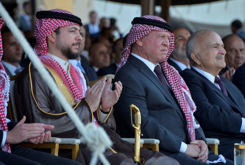 Jordan's King Abdullah II and Crown Prince Hussein at a performance before the start of a dinner. Reuters