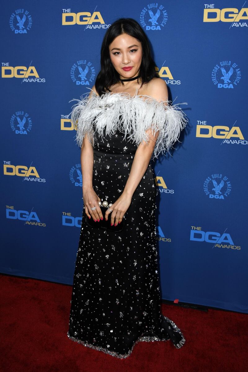 Constance Wu at the DGAs. Wu wore a Miu Miu dress, Melinda Maria earrings and Graziela Gems rings, with a Miu Miu clutch. AFP