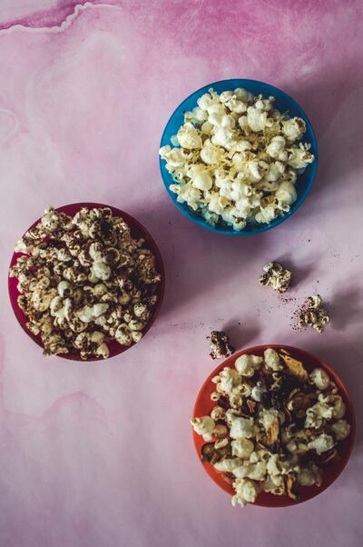 Gourmet popcorn can up the fun factor. Photo: Scott Price