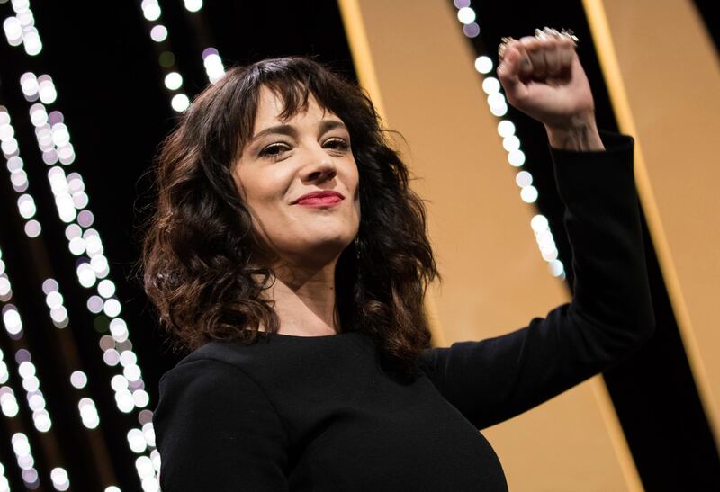 FILE - In this May 19, 2018 file photo, actress Asia Argento gestures during the closing ceremony of the 71st international film festival in Cannes, France. Argento, one of the most prominent activists of the #MeToo movement against sexual harassment, recently settled a complaint filed against her by a young actor and musician who said she sexually assaulted him when he was 17, the New York Times reported. (Vianney Le Caer/Invision/AP, FIle)