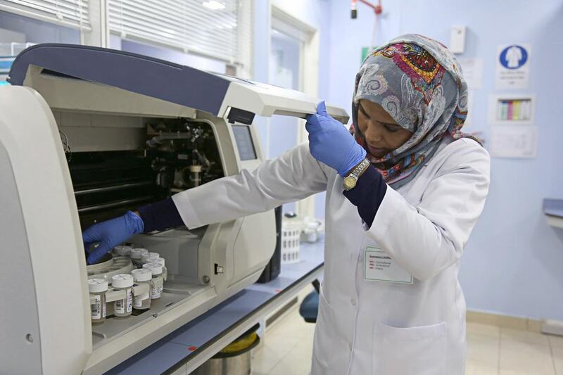 A technician at the histopathology unit of Al Borg Medical Laboratories in Abu Dhabi. Irene García León for The National