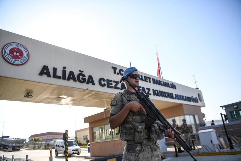 A Turkish soldier stands guard at the entrance of the Aliaga court and prison complex, during the trial of US pastor Andrew Brunson, held on charges of aiding terror groups, in Aliaga, north of Izmir, on July 18, 2018. - Andrew Brunson, head of a small Protestant church in the western city of Izmir, has been in detention since October 2016. Turkish prosecutors accuse Brunson of links to a group led by US-based Muslim preacher Fethullah Gulen -- who Ankara says was behind a failed 2016 coup -- and the Kurdistan Workers' Party (PKK). (Photo by OZAN KOSE / AFP)