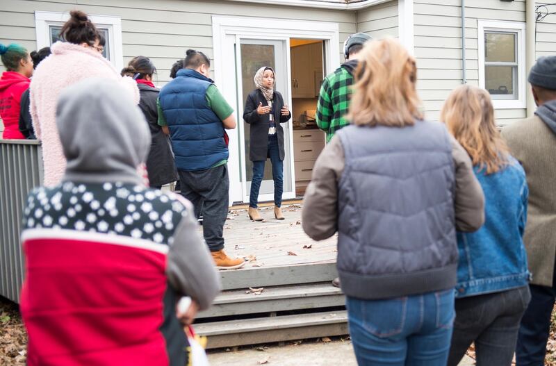 Democrat Ilhan Omar, who is campaigning for US House district 5, talks with supporters at a house in Minneapolis, Minnesota. EPA