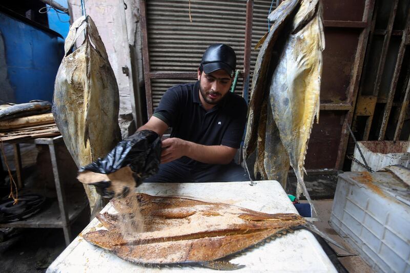Traditional Basra dried fish masmouta is prepared for sale at a market. Reuters
