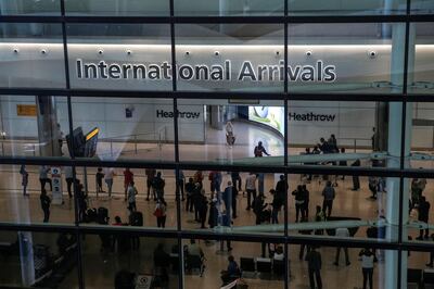 LONDON, ENGLAND - AUGUST 22: Travellers arrive at Heathrow Airport Terminal 2 on August 22, 2020 in London, England. As of Saturday morning at 4am, travellers arriving in England from Austria, Croatia, and Trinidad and Tobago were required to quarantine themselves for 14 days. At the same time, travellers from Portugal were no longer required to quarantine. (Photo by Hollie Adams/Getty Images)