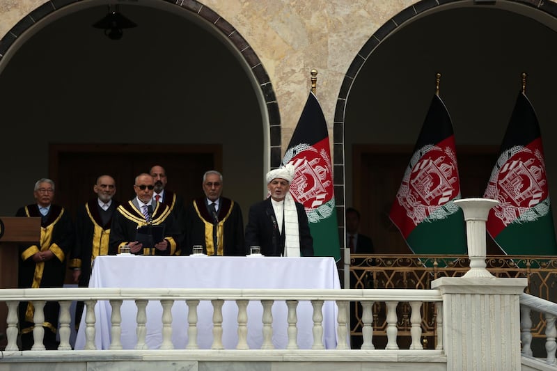 Afghan President Ashraf Ghani is sworn in by Chief Justice Sayed Yousuf Halim, during his inauguration ceremony at the presidential palace in Kabul. AP