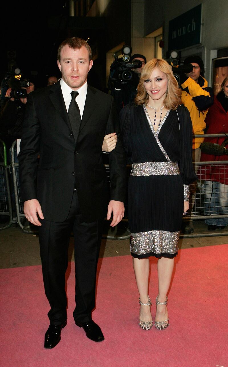 LONDON - NOVEMBER 29:  Madonna and Guy Ritchie arrive at the UK TV documentary premiere of her new confessional Channel 4 documentary "I'm Going To Tell You A Secret" at the ChelseaCinema on November 29, 2005 in London, England. The programme. Transmitting on December 1, is the first Madonna confessional since 1991's controversial Madonna: Truth Or Dare documentary, profiling the Blonde Ambition tour.  (Photo by MJ Kim/Getty Images)