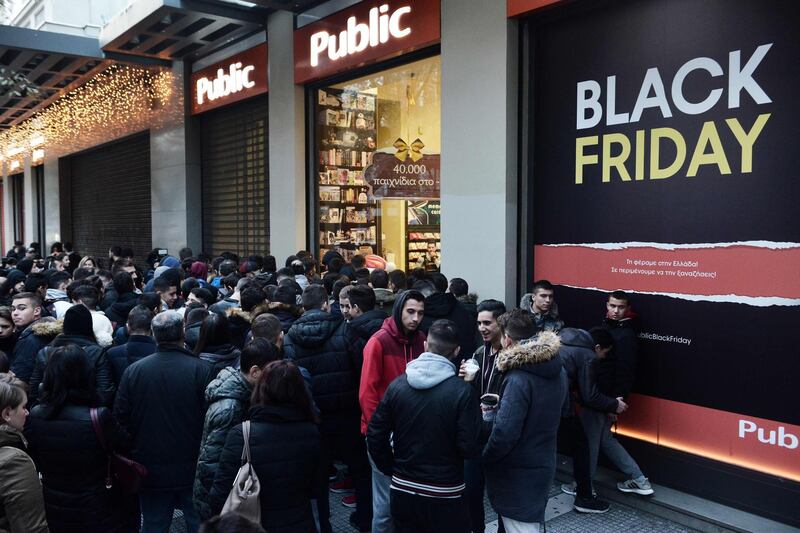People wait outside a department store in Thessaloniki, Greece for the  Black Friday shopping craze. Sakis Mitrolidis / AFP Photo