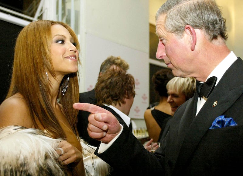 Beyonce talks with Britain's Prince of Wales during the reception at the Fashion Rocks concert and fashion show in aid of the Prince's Trust at the Royal Albert Hall in London, October 15, 2003. Reuters
