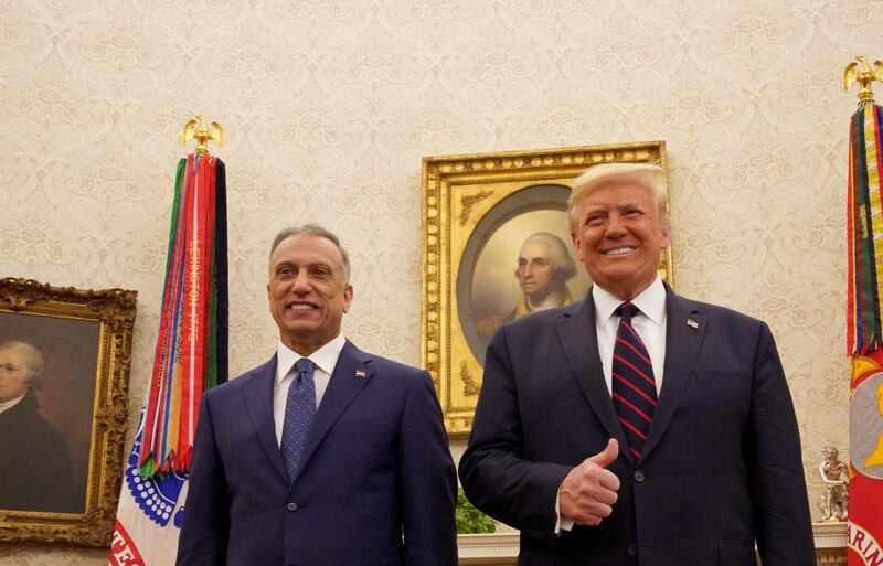 FILE PHOTO: U.S. President Donald Trump receives Iraq's Prime Minister Mustafa al-Kadhimi in the Oval Office at the White House in Washington, U.S., August 20, 2020. Iraqi Prime Minister Media Office/Handout via REUTERS ATTENTION EDITORS - THIS IMAGE WAS PROVIDED BY A THIRD PARTY/File Photo