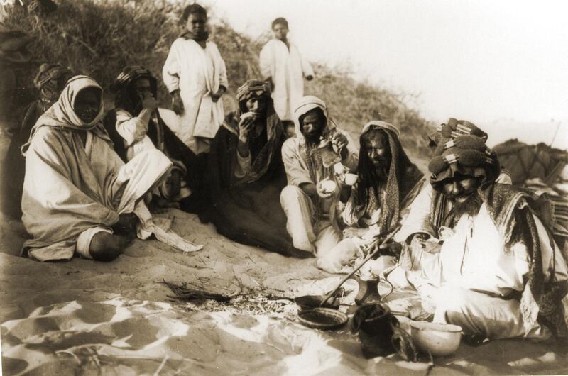 then a photo by traveler Hermann Burchardt of tribes pausing for coffee break in the desert between Hufuf and Qatar dating 1904

Courtesy National Center for Documentation and Research.