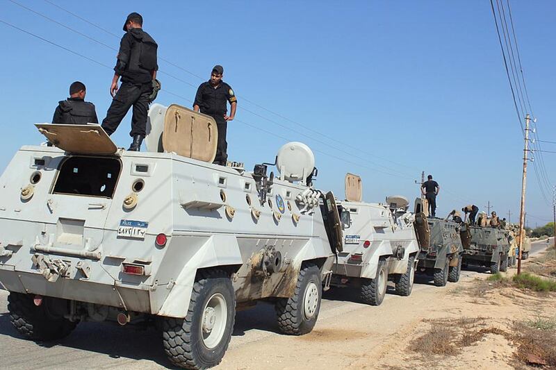 Egyptian security forces stand by their armoured personnel carriers ahead of a military operation in the northern Sinai peninsula last year. AFP