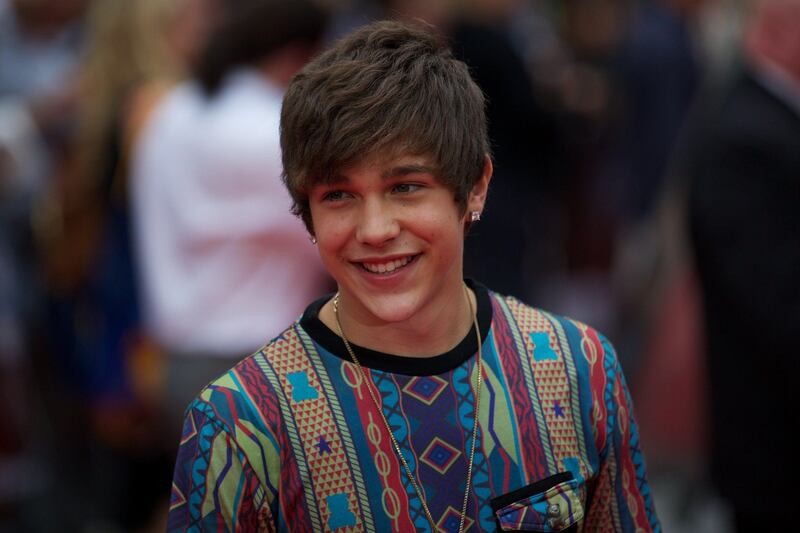 US pop singer Austin Mahone  poses for photographers on the red carpet as he arrives for the UK premier of the film 'The Wolverine' in London on July 16, 2013. AFP PHOTO/ANDREW COWIE
 *** Local Caption ***  561497-01-08.jpg