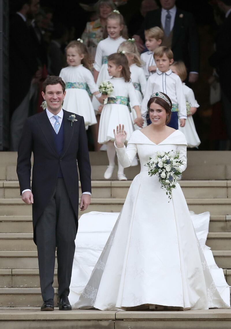 WINDSOR, ENGLAND - OCTOBER 12: Jack Brooksbank and Princess Eugenie of York walk down the steps followed by their page boys and bridesmaids after their wedding ceremony at St. George's Chapel on October 12, 2018 in Windsor, England. (Photo by Andrew Matthews - WPA Pool/Getty Images)