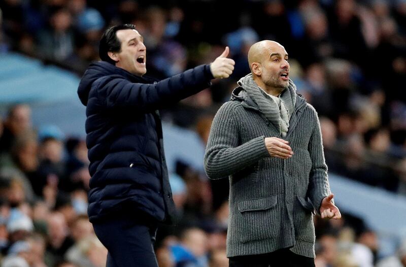 Guardiola reacts as Arsenal manager Unai Emery gestures. Action Images via Reuters