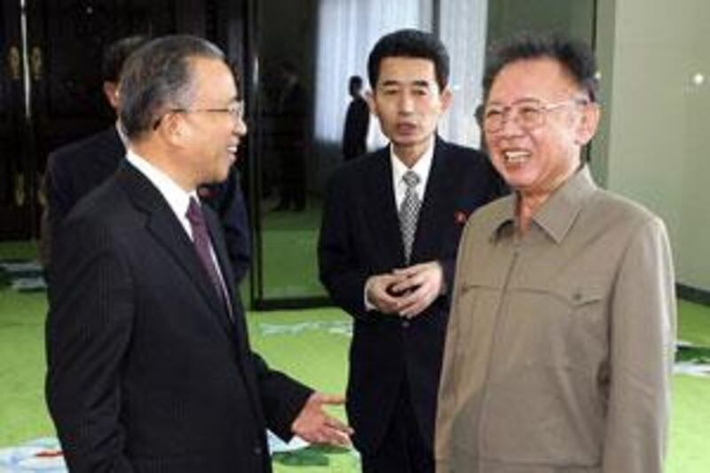 The North Korean leader Kim Jong Il, right, with the Chinese president Hu Jintao's special envoy Dai Bingguo, left, in Pyongyang.