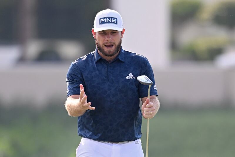 Tyrrell Hatton, who finished joint second, reacts after missing a putt on the 14th. Getty