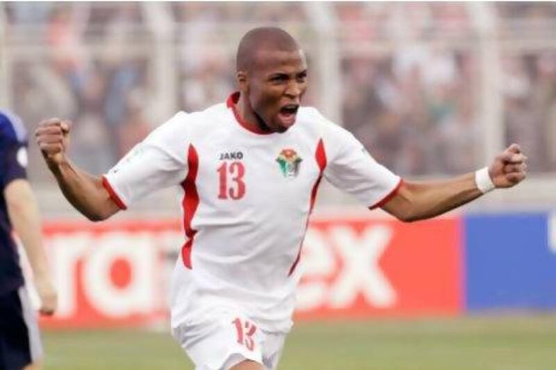 Jordan's Khalil Bani Ateyah celebrates after scoring the first goal in a 2-1 win over Japan in a World Cup Group B Asian qualifier on Tuesday. Khalil Mazraawi / AFP