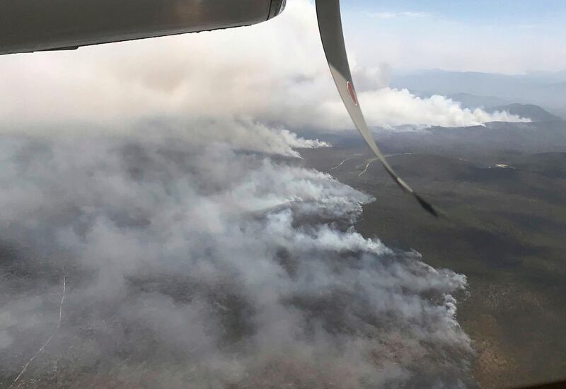 In this undated photo released by the Queensland Fire and Emergency Service fires burn north of Bundaberg, Australia. Hundreds of firefighters are preparing for worse conditions on Wednesday, Nov. 28, 2018, when temperatures are expected to reach 40 degrees Celsius (104 degrees Fahrenheit) with winds reaching 40 kph (25 mph). (QLD Fire and Emergency via AP)