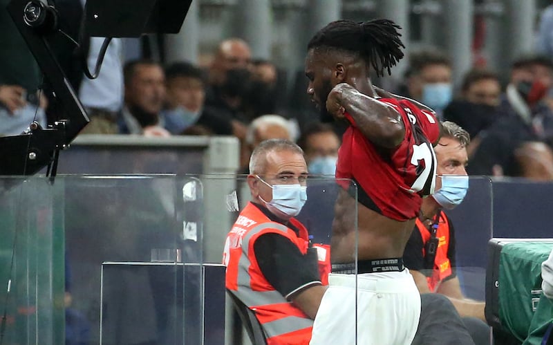 AC Milan's Franck Kessie leaves the pitch after being sent off. EPA