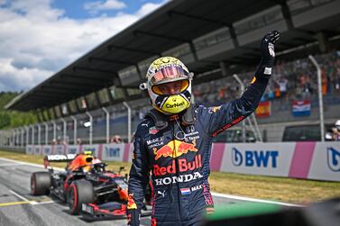 Red Bull driver Max Verstappen of the Netherlands waves in the winners circle after he placed first to take pole position during the qualifying session ahead of the Austrian Formula One Grand Prix at the Red Bull Ring racetrack in Spielberg, Austria, Saturday, July 3, 2021.  The Austrian Grand Prix will be held on Sunday.  (Christian Bruna / Pool Photo via AP)